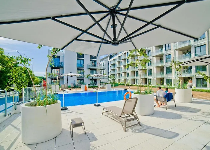 Апартаменты Porty B103 Nadmorskie Tarasy Pool Sauna Parking Колобжег